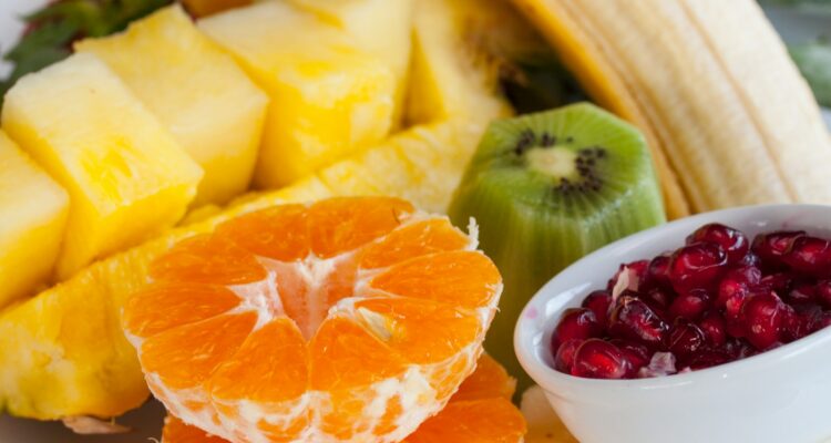 sliced orange fruit on white ceramic bowl